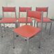 Set of 4 vintage chrome and orange faux leather chairs.