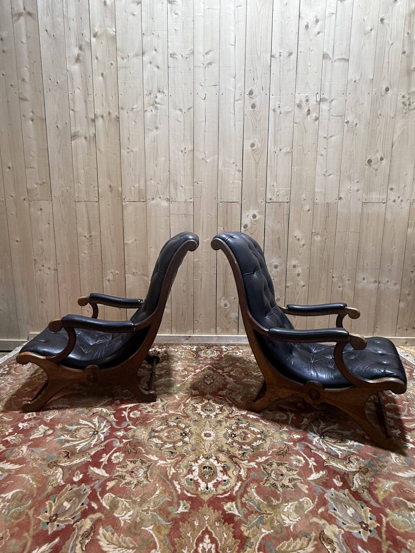 Pair of English Chesterfield armchairs in black leather