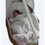 Vintage 1970s wicker cradle on wheels