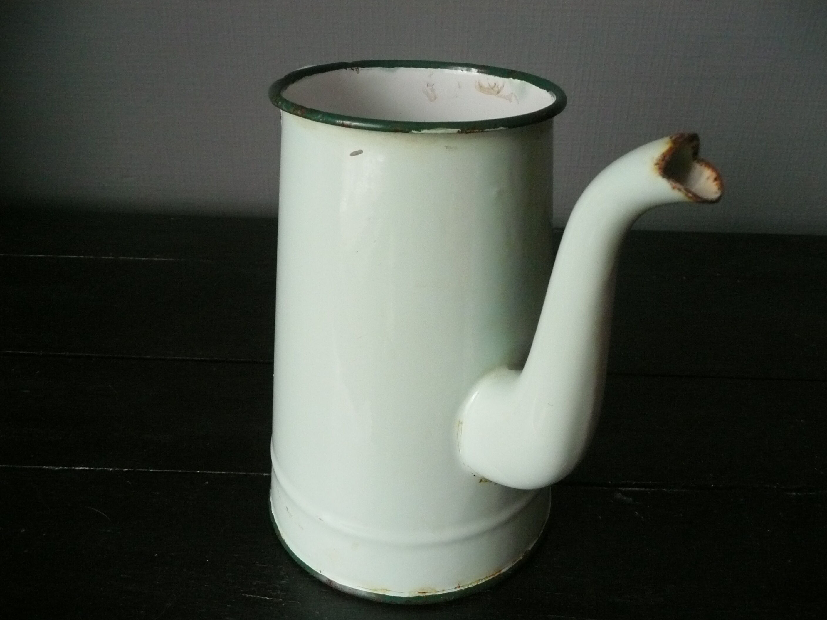 Antique enamelled pitcher