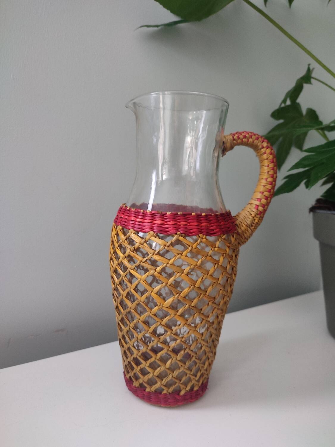 Glass and raffia water carafe