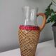 Glass and raffia water carafe