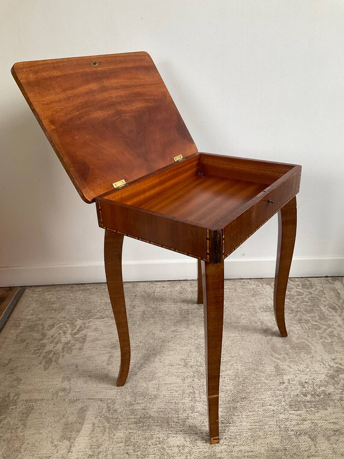 Small marquetry pedestal table with key storage