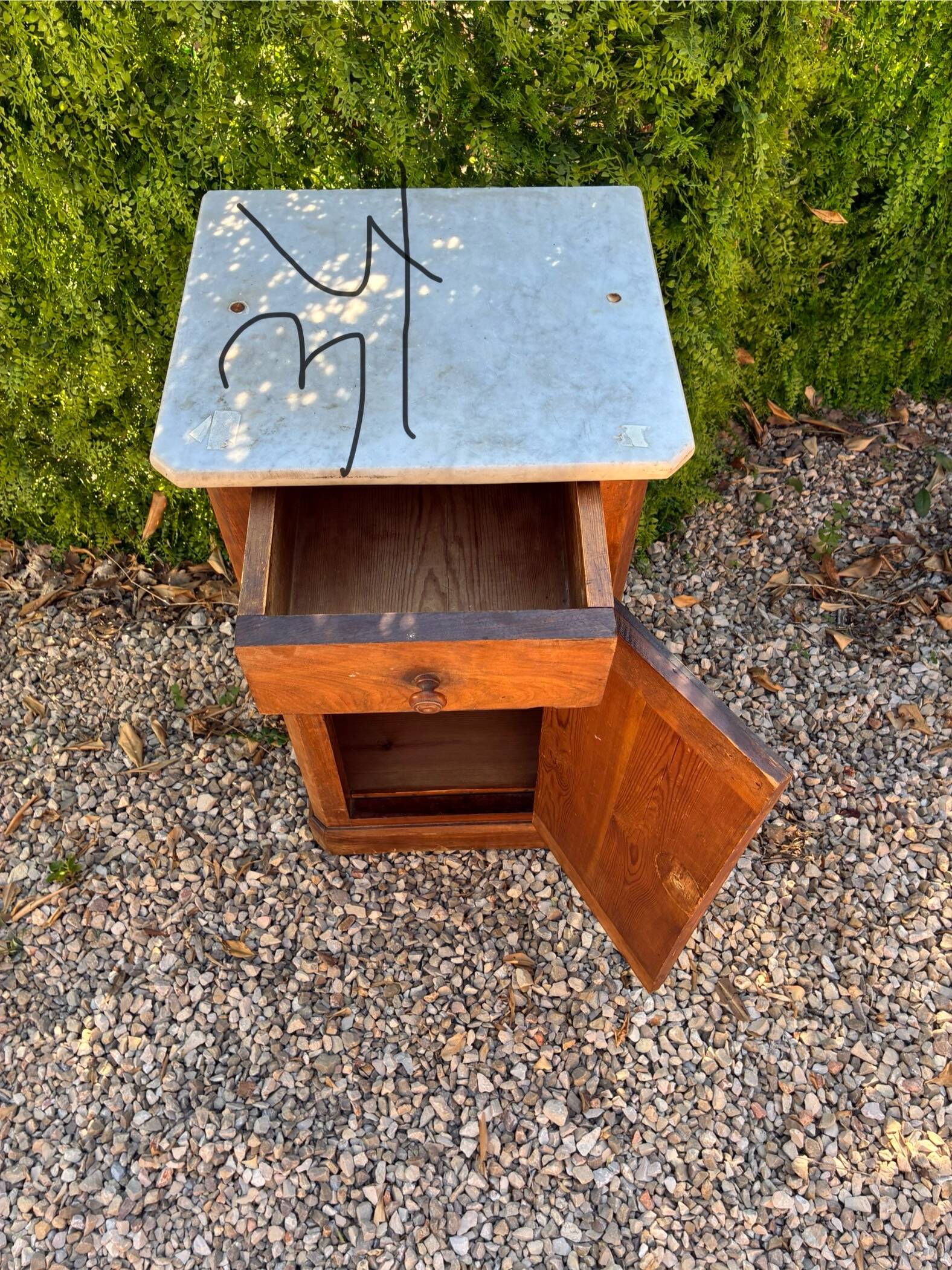 Antique wooden bedside table with marble