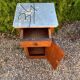 Antique wooden bedside table with marble
