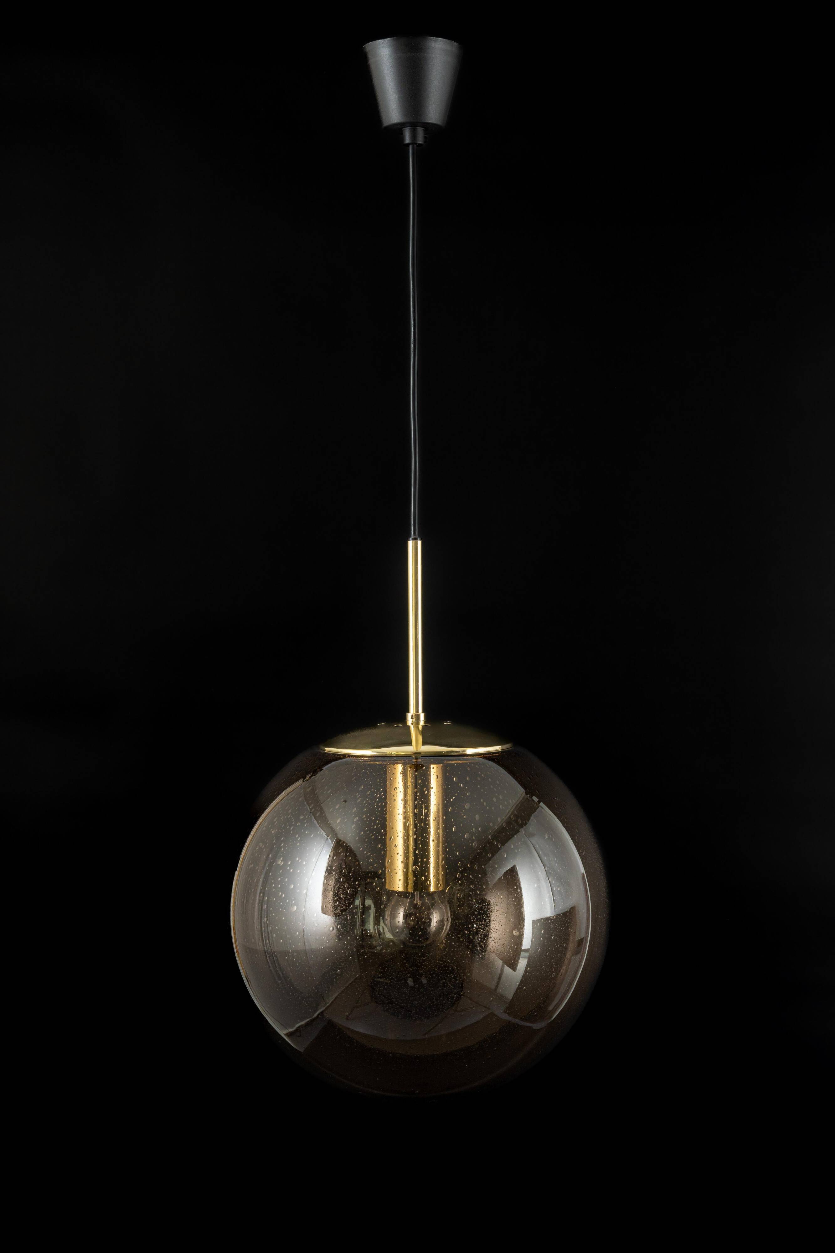 Large smoked glass ball pendant by Limburg in brass, Germany, 1970s.