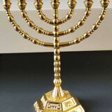 Menorah/Jewish/Hebrew candlestick with 7 arms of light. Engraved with the symbols of the 12 tribes of Israel/Holyland inscription. In gold metal. Size 20 x 16 cm