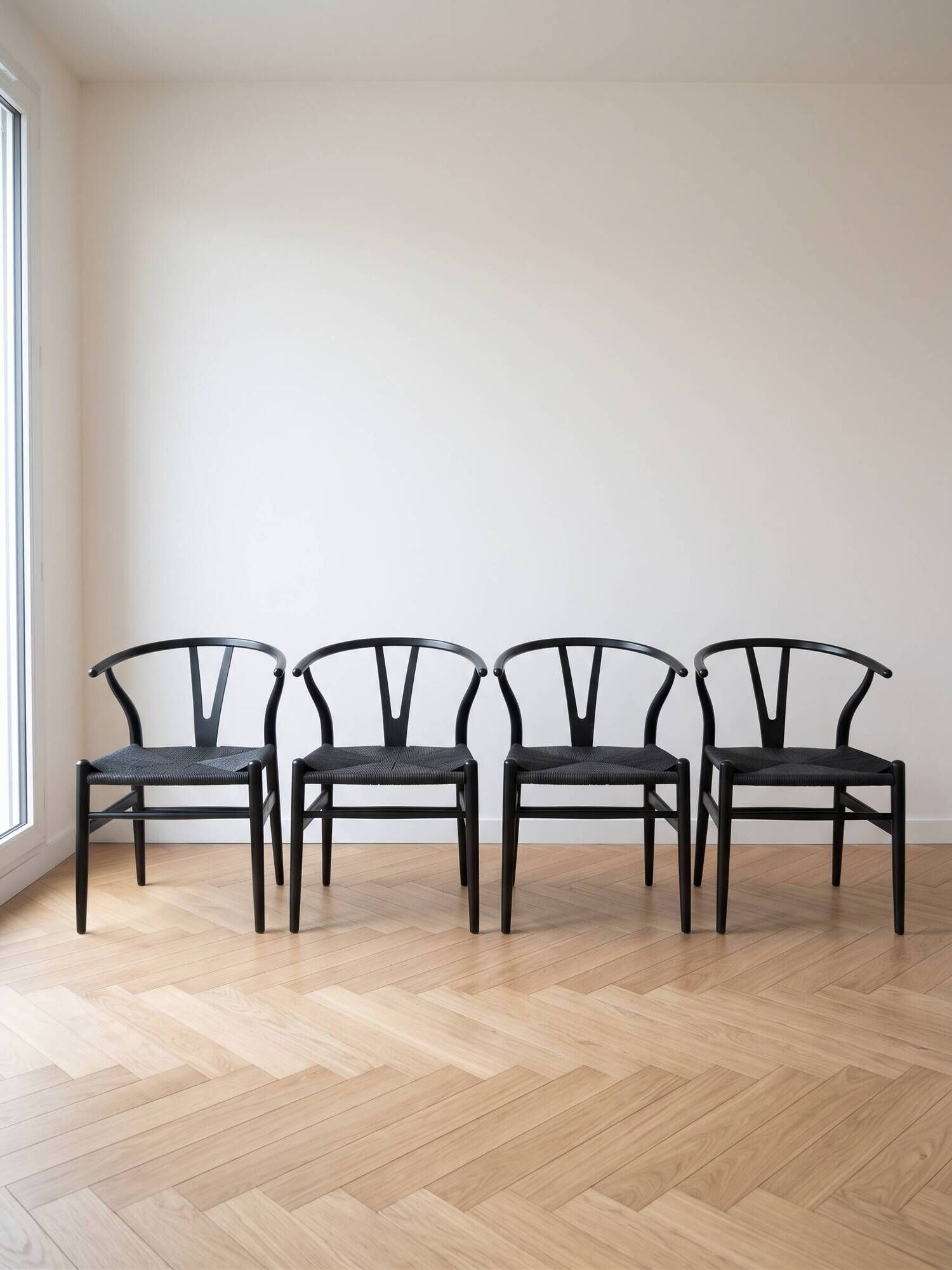 Set of 4 vintage Scandinavian Wishbone style chairs in black wood.