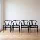 Set of 4 vintage Scandinavian Wishbone style chairs in black wood.