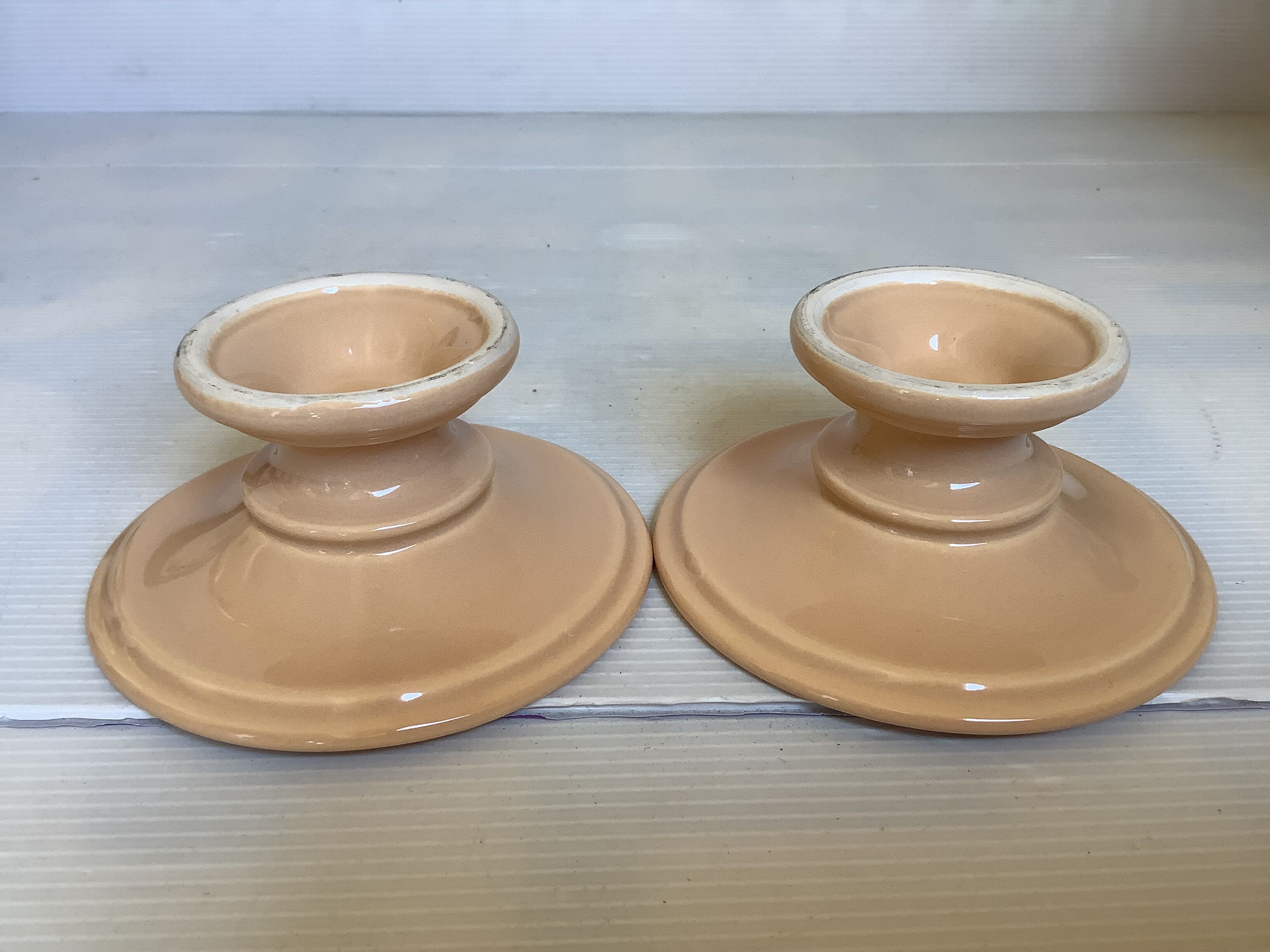 Pair of beige candlesticks