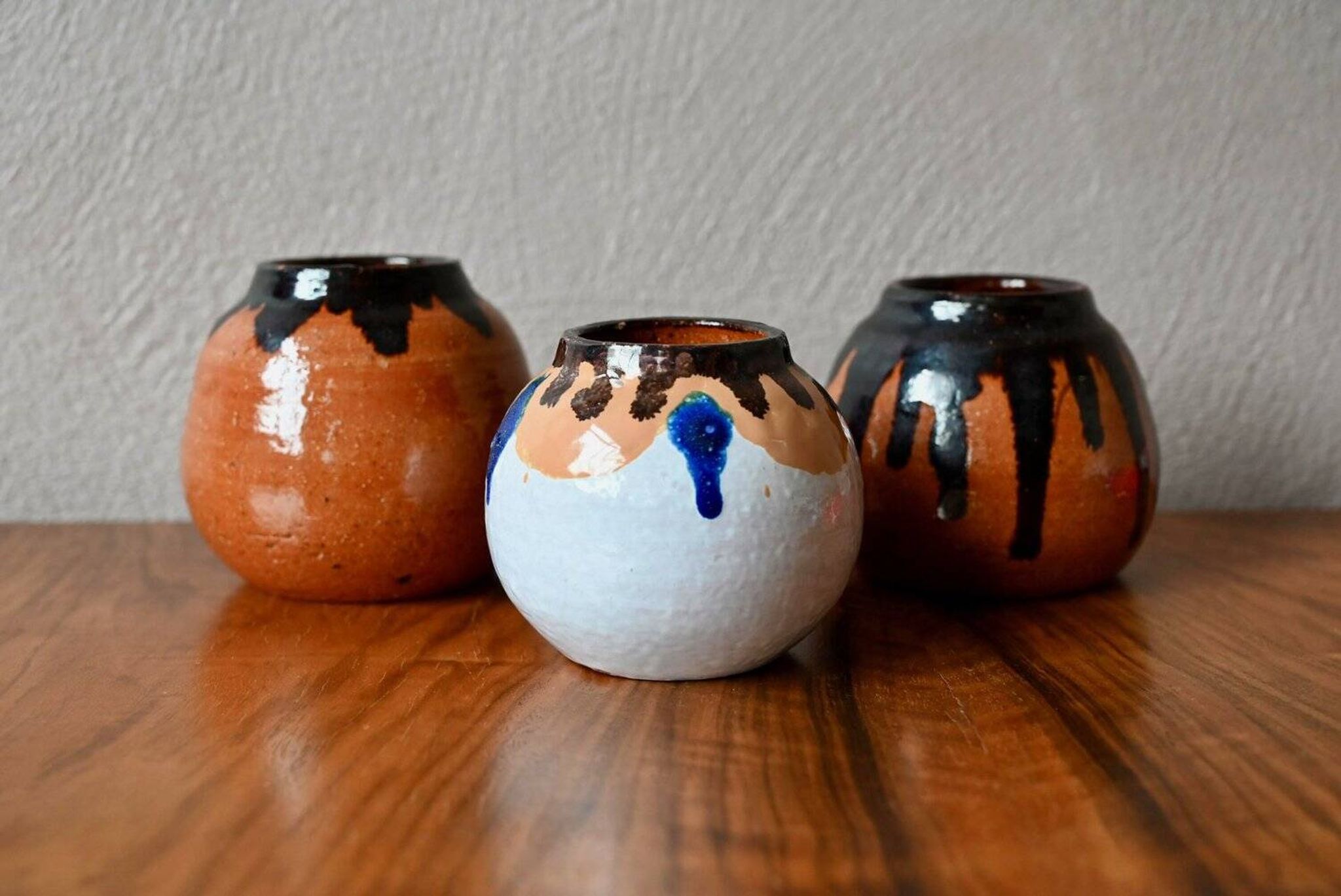 Set of three ethnic glazed terracotta ball vases from the 1970s.