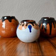 Set of three ethnic glazed terracotta ball vases from the 1970s.