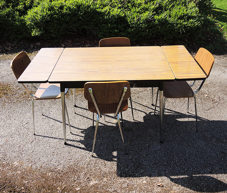 4 old chairs and an extendable table in 'faux wood' formica.