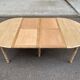 Round dining table with extendable leaves, Louis Philippe style, stripped in raw oak.