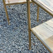 Pair of neoclassical side tables in bronze, brass, marble, and o.