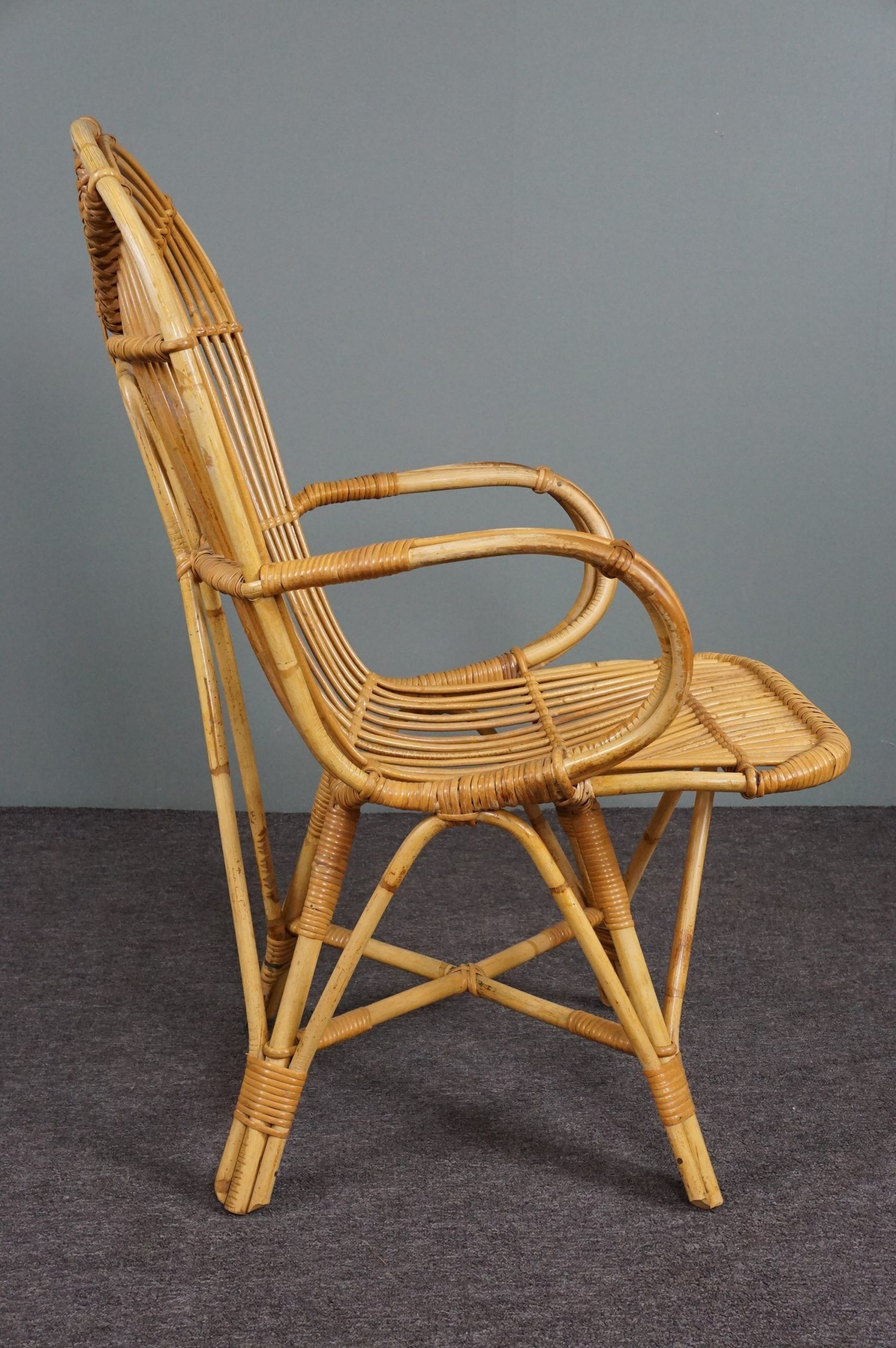 Rattan armchair with armrests by Rohé Noordwolde