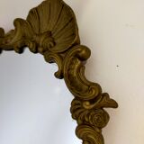 Gilded bronze mirror with angels and scrolls