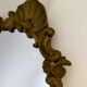 Gilded bronze mirror with angels and scrolls