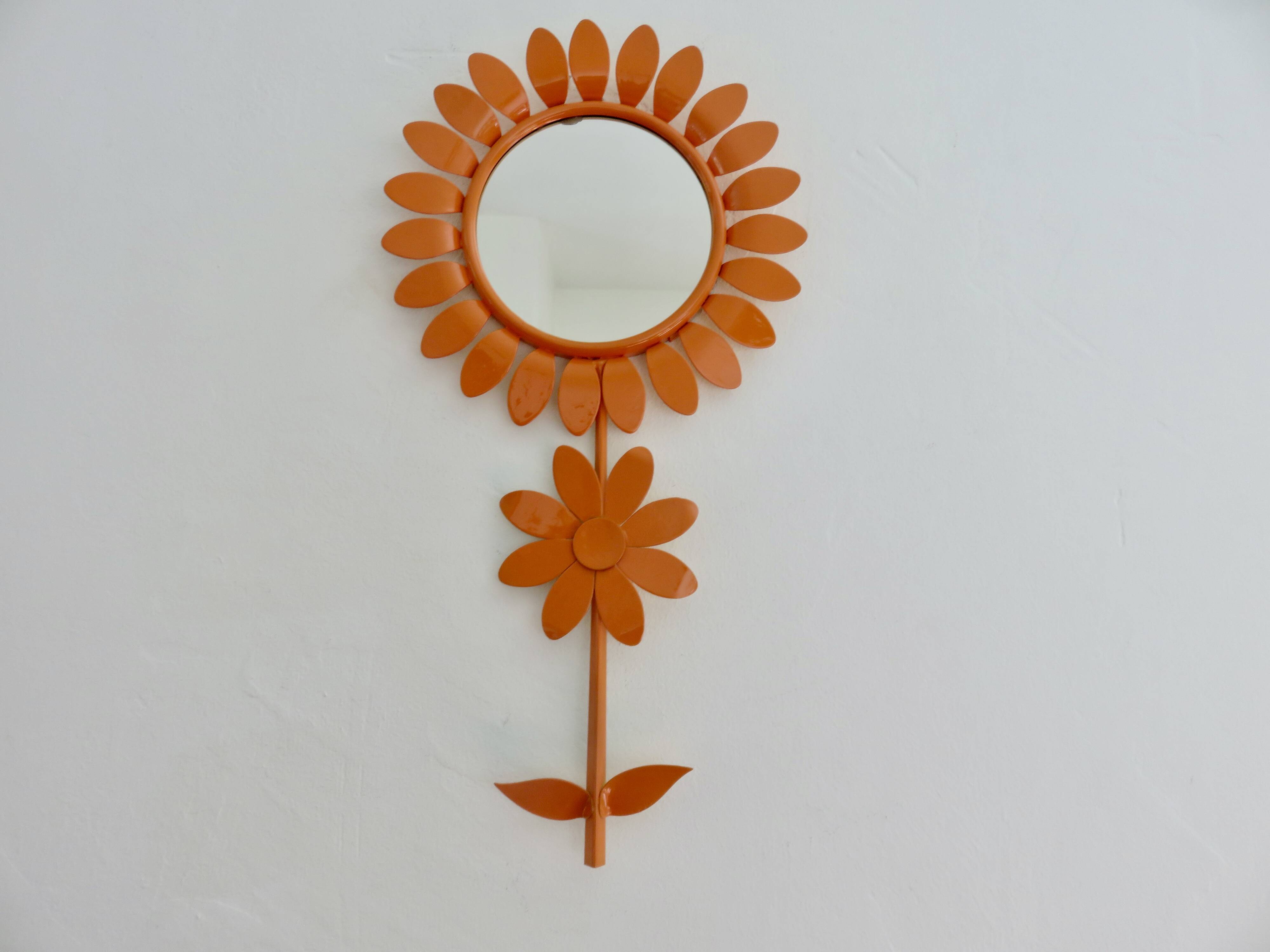 Large 1970s "flower" mirror in orange metal