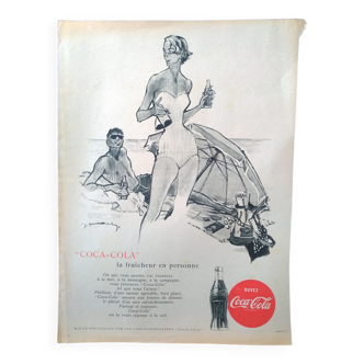 A Coca-Cola paper advertisement beach illustration from a period magazine