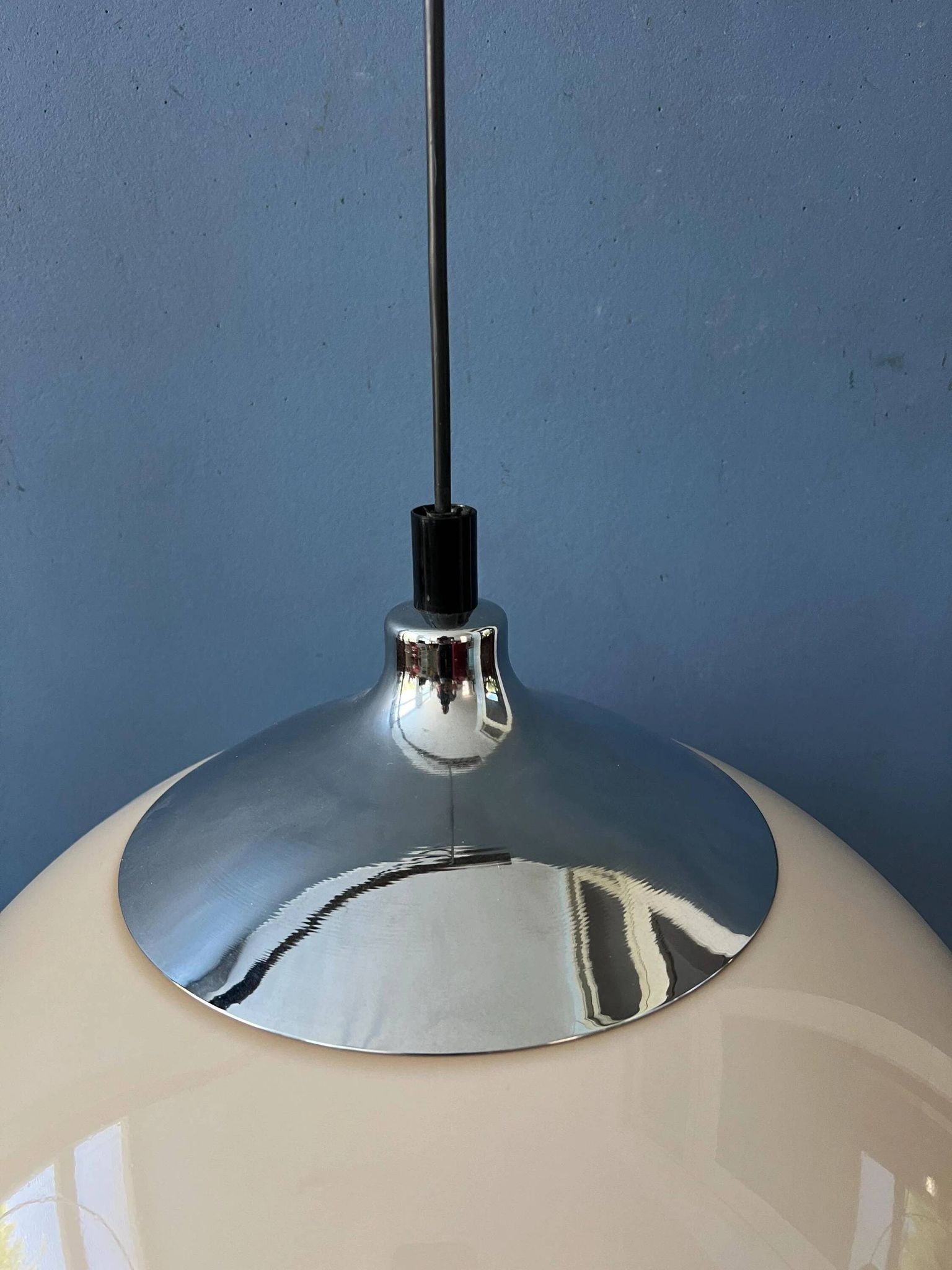 Beige acrylic glass mushroom pendant with a chrome top cap.