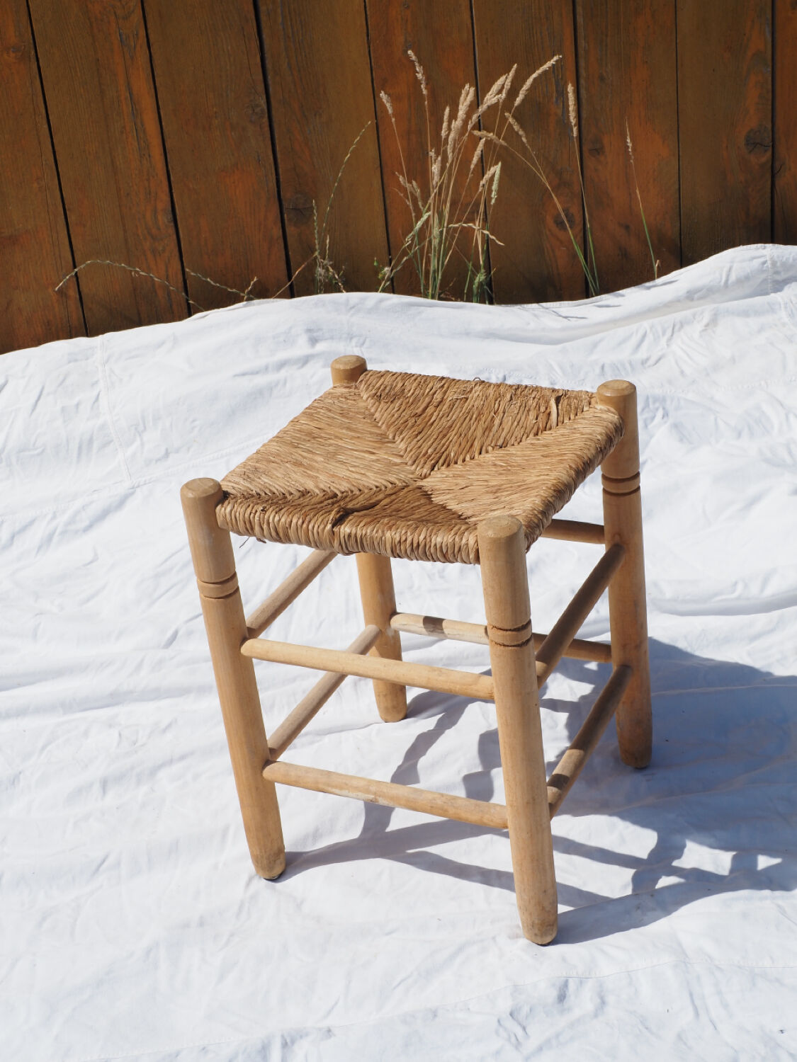 Farm stool made of wood and straw
