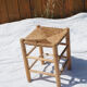 Farm stool made of wood and straw