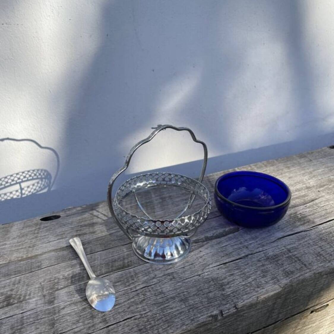 Silver-plated metal and blue glass sugar and salt shaker
