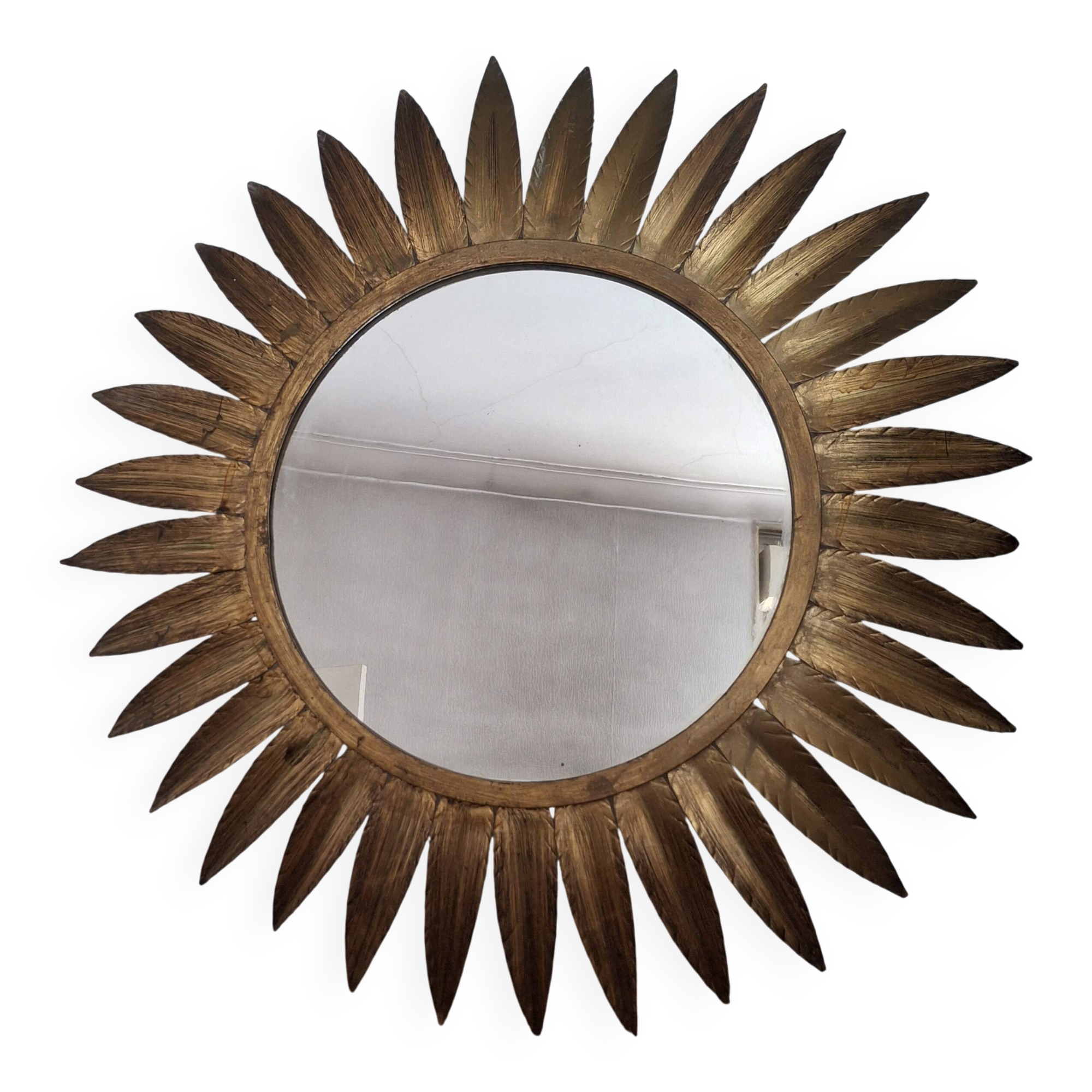 Large sun mirror in gilded metal. 1960