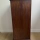 Vintage bedside table in the shape of a wooden column and a gray marble top