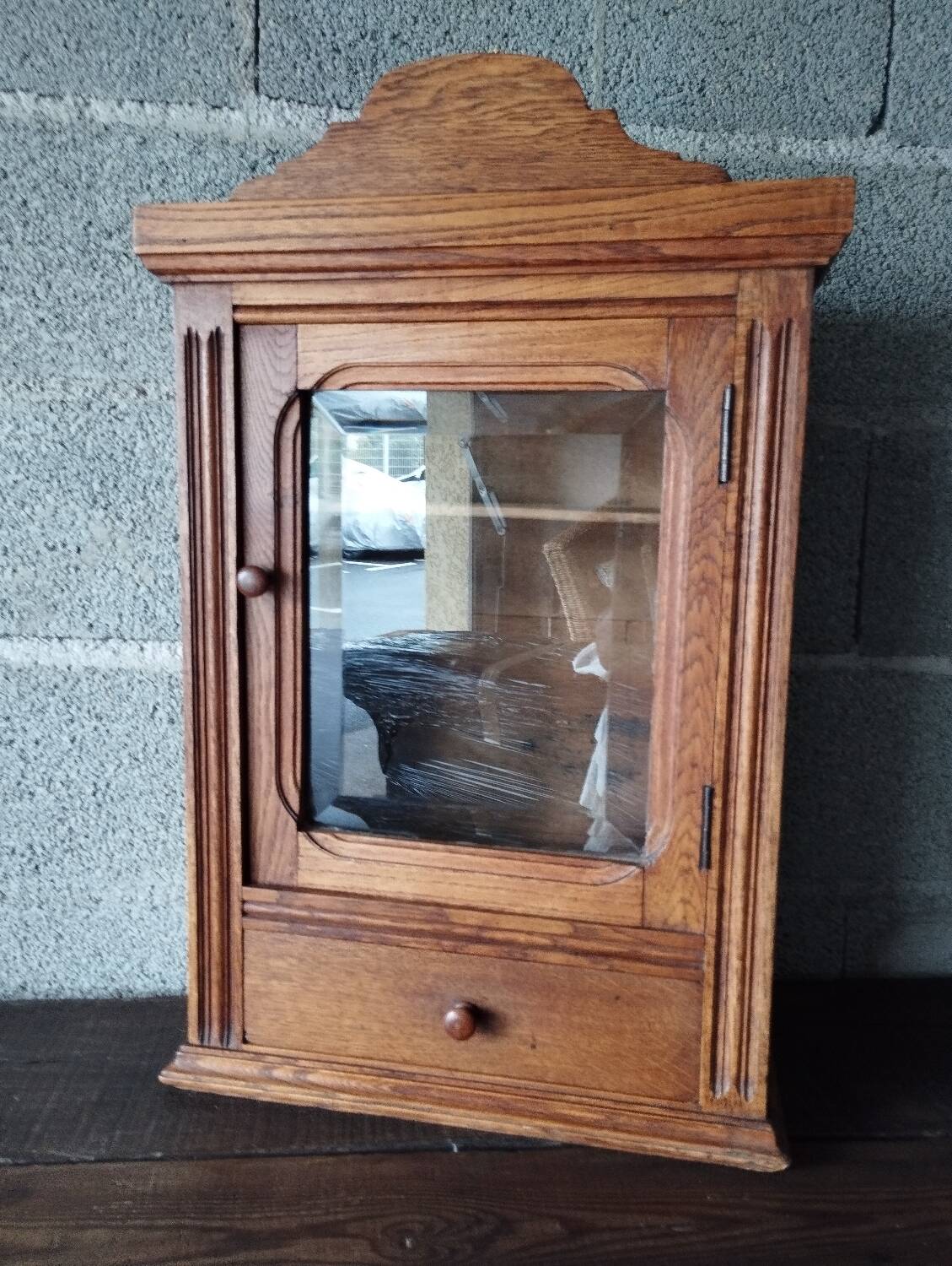 Old glass wall shelf with drawer door