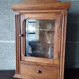 Old glass wall shelf with drawer door