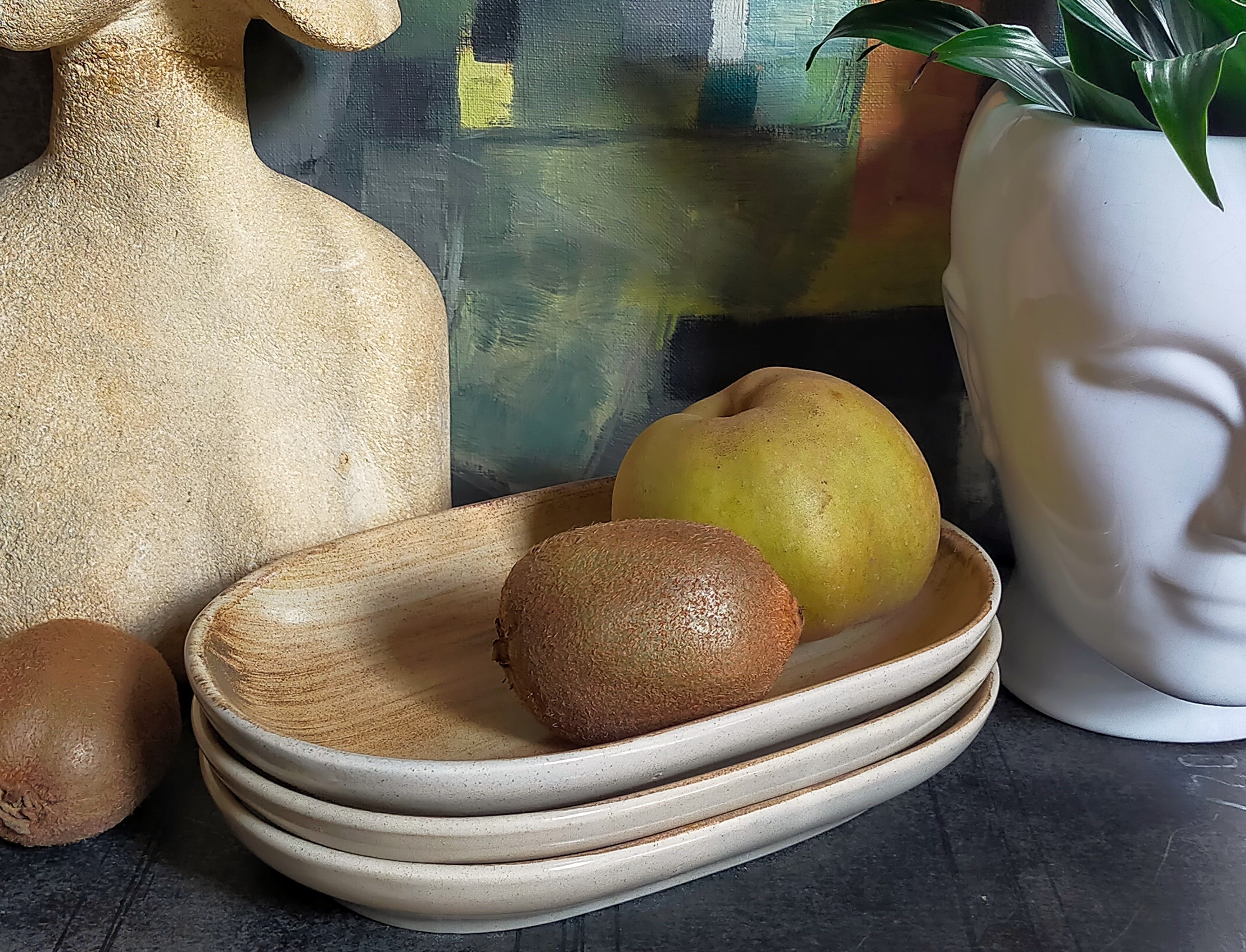 Three ceramic raviers decorated with vintage brushstrokes