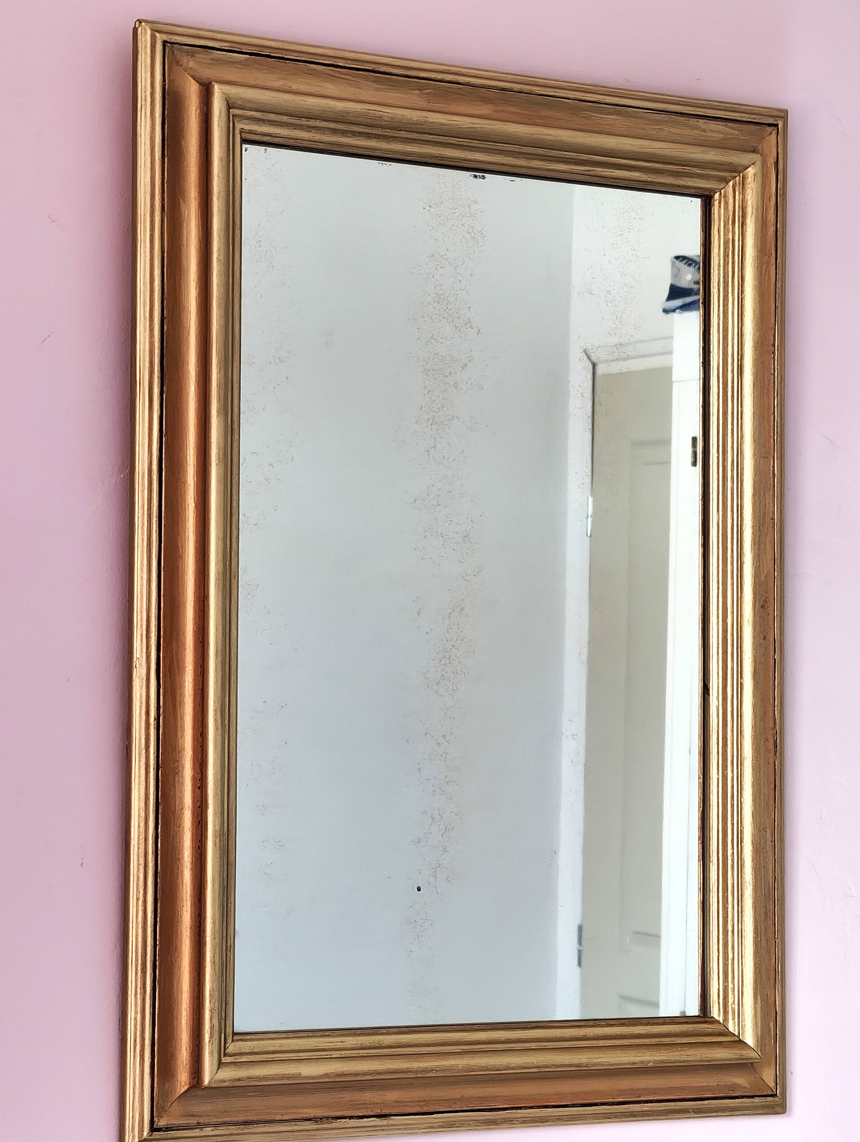 Miroir ancien en bois doré et cuivré
