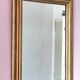 Miroir ancien en bois doré et cuivré
