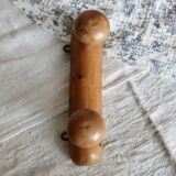 Antique wooden coat rack with two round hooks