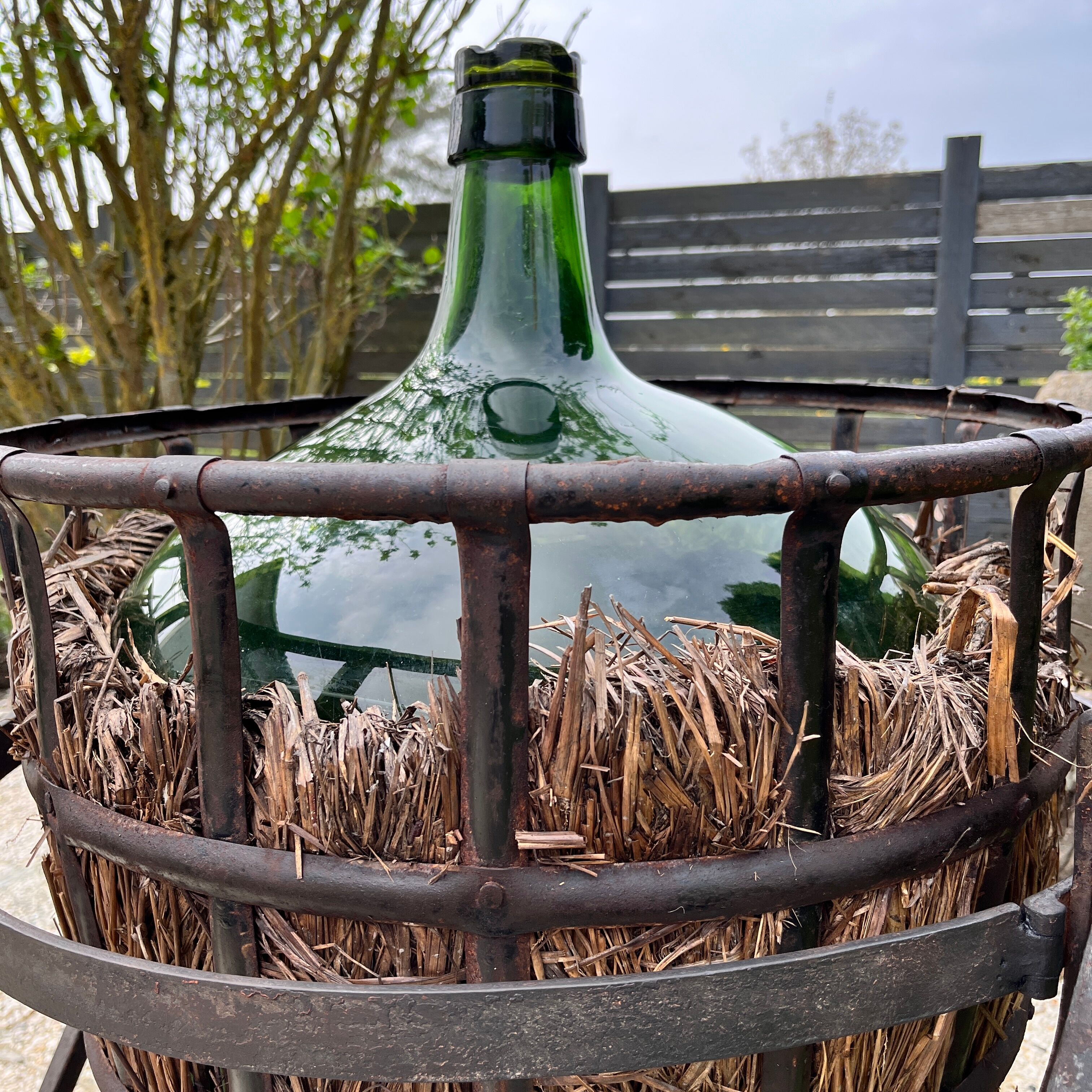 Demijohn on steel rocker