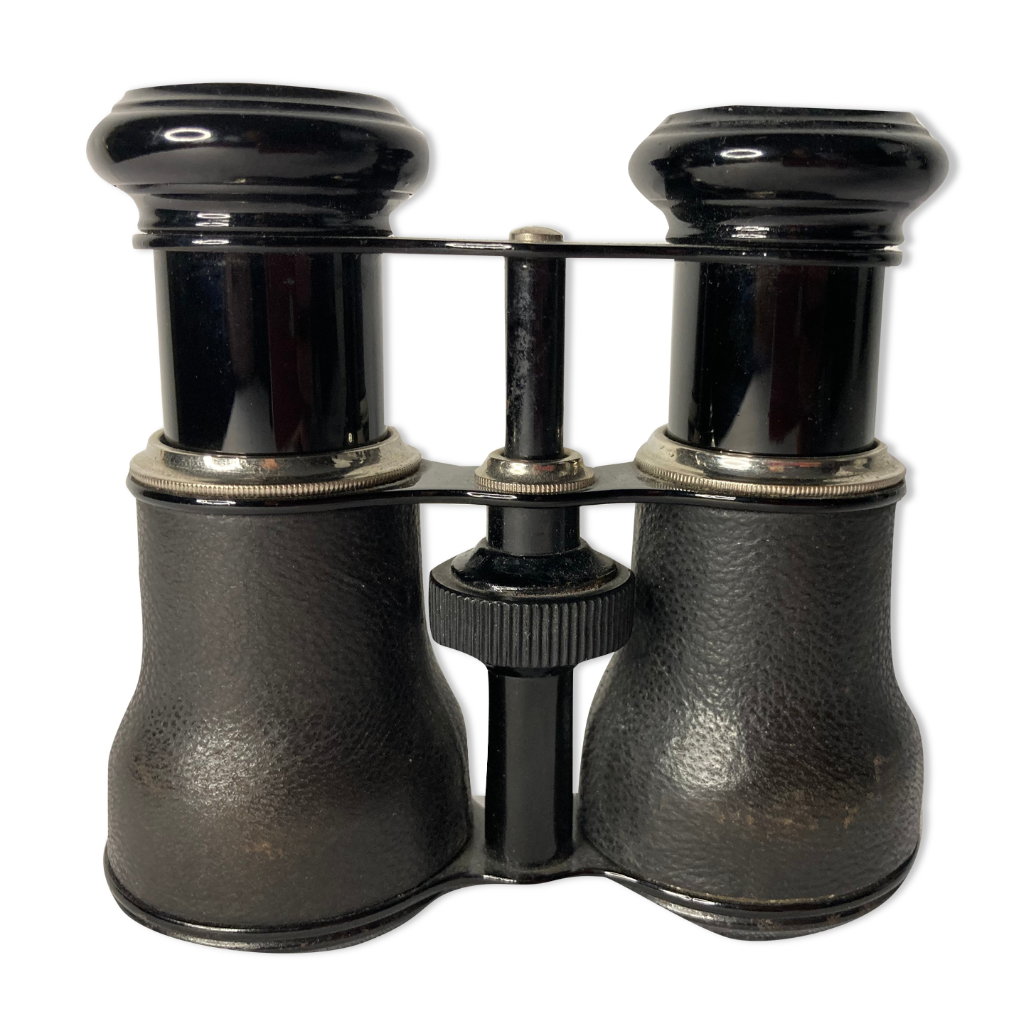 Old pair of binoculars sheathed leather black silver metal