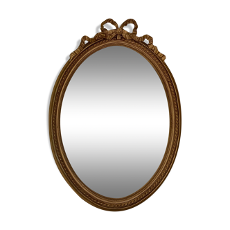 Golden oval mirror with knot