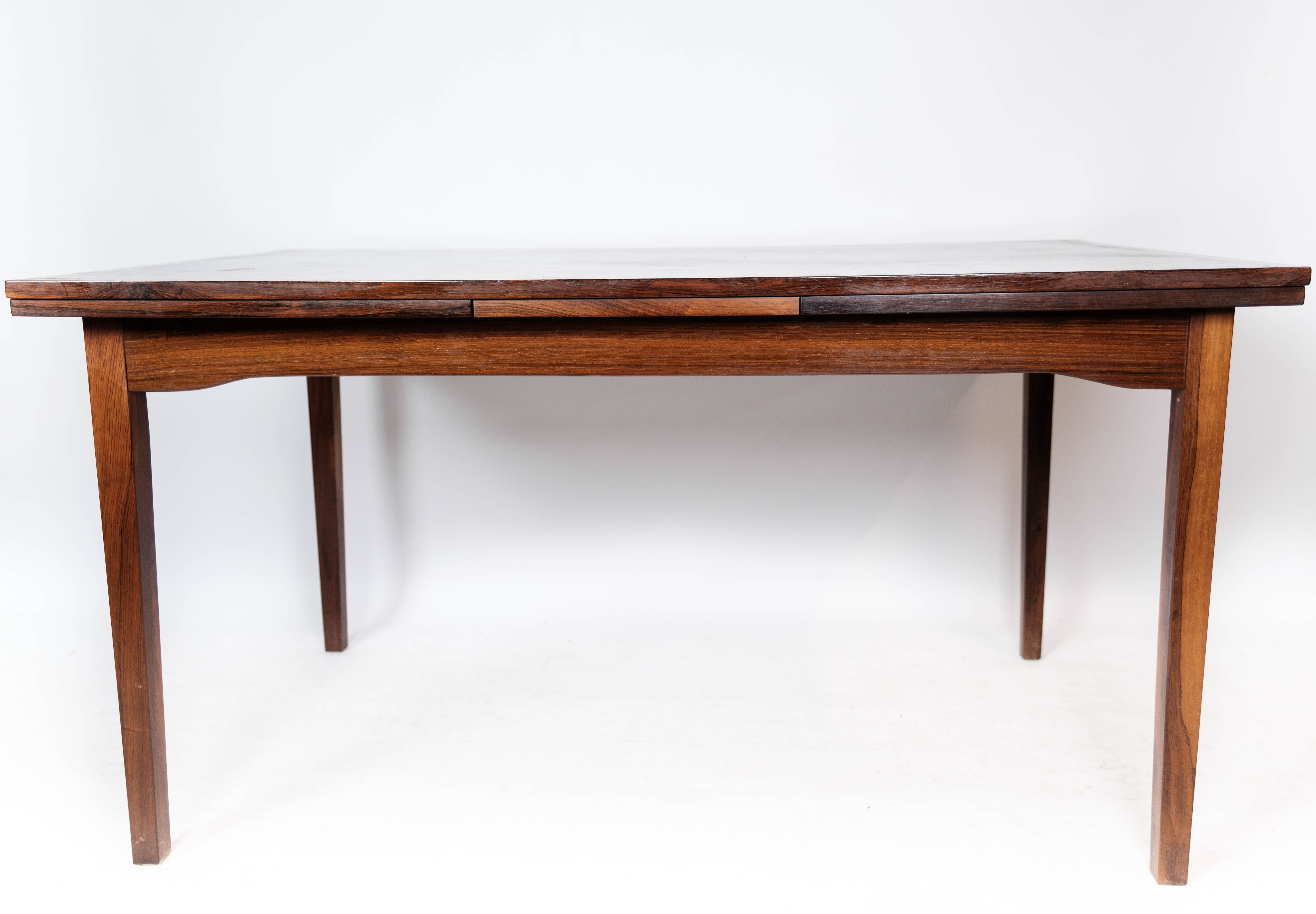 Dining table in rosewood with extension, of Danish design by Ellegaards Furniture, 1960s