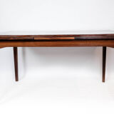 Dining table in rosewood with extension, of Danish design by Ellegaards Furniture, 1960s
