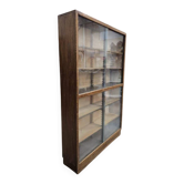 Vintage shallow wooden display shelf with sliding glass doors.
