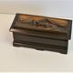 Vintage carved wooden box of a mountain landscape in relief
