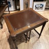 Classic nesting tables in wood and leather.