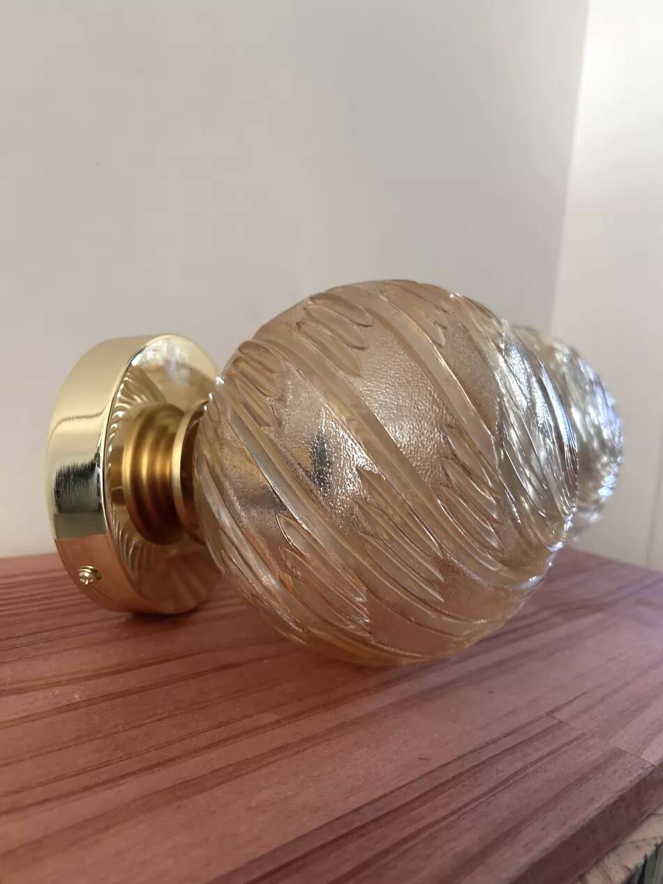 Pair of golden globe wall lights
