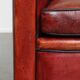 Armchair made of sheepskin leather in a red/brown color