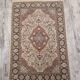 Handmade Persian carpet in wool and silk.