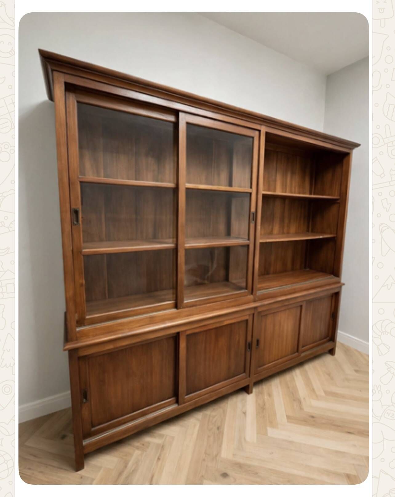 Large double-body showcase library in solid teak.