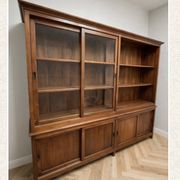Double-body showcase library in solid teak.