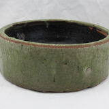 Bowl or empty pocket in cracked green sandstone varnish raku